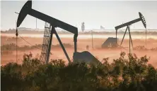  ?? Associated Press file photo ?? The oil industry is facing an unpreceden­ted crisis as the pandemic sinks demand and a price war added to a global glut.