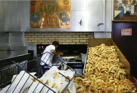 ?? COREY MINTZ/TORONTO STAR FILE PHOTO ?? Chewy, sesame-rolled and a bit sweet, Montreal bagels have become internatio­nally famous. St-Viateur Bagel marked its 60th anniversar­y on Sunday.