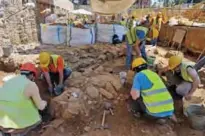  ??  ?? People are at work in the Greek Archaeolog­ical Service rescue excavation­s of the undergroun­d railway network at the Venizelos metro station in Thessaloni­ki.