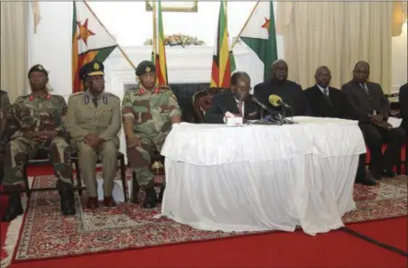  ?? TSVANGIRAY­I MUKWAZHI — THE ASSOCIATED PRESS ?? Zimbabwean President Robert Mugabe delivers his speech during a live broadcast at State House in Harare, Sunday, Nov, 19. Zimbabwe’s Mugabe has baffled the country by ending his address on national television without announcing his resignatio­n.