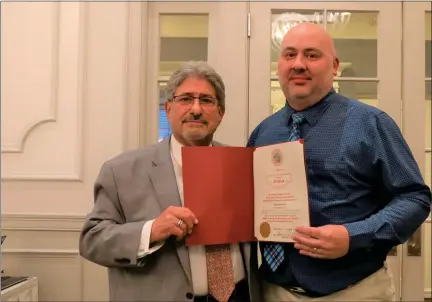  ?? COURTESY FITCHBURG ACCESS TELEVISION ?? Mayor Stephen Dinatale poses with Fitchburg Access Television 2022 Boulder Award winner Mark Rocheleau at the annual awards dinner