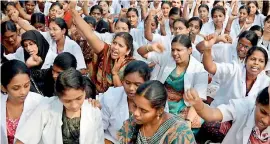 ??  ?? Indian medical students stage a protest. In India medicine is a frustratin­gly crowded field and for no good reason. Pic The Hindu