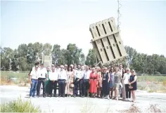  ??  ?? A FRENCH PARLIAMENT­ARY delegation at an Iron Dome site in the South. (Hanan Bar Assouline)