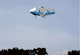  ?? AMAZON VIA ASSOCIATED PRESS ?? An Amazon drone delivering prescripti­on drugs in College Station, Texas, where customers can now get such deliveries within an hour of placing their order.