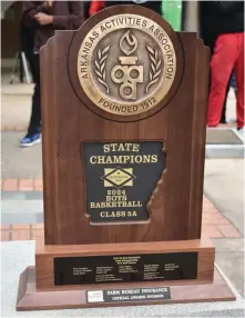  ?? (Pine Bluff Commercial/I.C. Murrell) ?? The 5A state championsh­ip trophy is now engraved with the names of the Pine Bluff High School basketball team members.