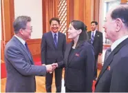  ?? AFP/GETTY IMAGES ?? South Korean President Moon Jae-in greets Kim Yo Jong, sister of North Korean leader Kim Jong Un, Saturday in Seoul. She invited Moon to talks in North Korea.