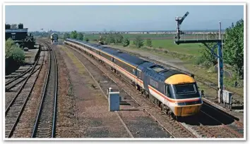  ?? STEVE TURNER. ?? From 1991, sufficient HSTs were available to permit their use on Euston to Holyhead diagrams. On August 30 1994, the 1411 Holyhead-London Euston, with 43005 leading, passes Holywell.