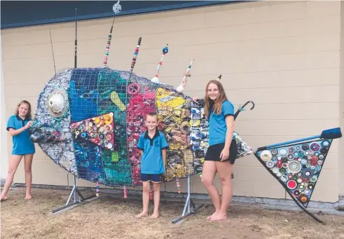  ?? Picture: SUPPLIED ?? QUITE A CATCH: Wonga Beach State School students helped make a giant fish sculpture filled with rubbish collected from nearby beaches. Students Kiara Smith, Cash Reilly and Charli Reilly show off their handiwork.