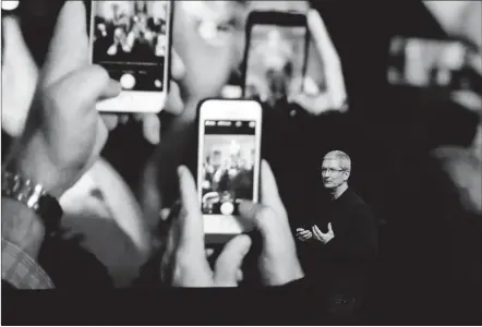  ?? MARCIO JOSE SANCHEZ/AP ?? With iPhone sales dragging, Apple CEO Tim Cook announces the new iPhone 7 on Wednesday in San Francisco. It won’t include an analog headphone jack — a longtime staple in most electronic devices that can play audio — so consumers will also need to buy...