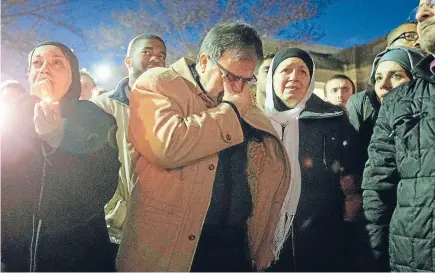  ?? Photo: REUTERS ?? Hate crime: Namee Barakat and his wife Layla, in centre, parents of shooting victim Deah Shaddy Barakat, are seen during a vigil on the campus of the University of North Carolina in Chapel Hill, last month. Gunman Stephen Hicks, who had posted...