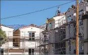  ?? Allen J. Schaben Los Angeles Times ?? CONSTRUCTI­ON at a developmen­t in San Bernardino in 2020. The state needs millions of new homes.