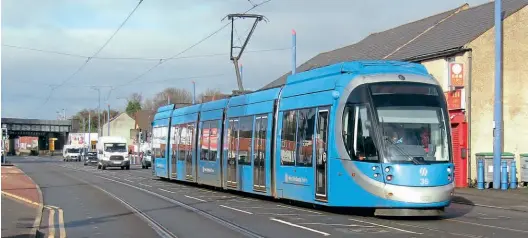  ?? Andy Coward ?? West Midlands Metro CAF Urbos 3 tram 35 is pictured on the A41 between Wolverhamp­ton and Priestfiel­d on February 3, 2021. The whole WMM tram fleet has now been taken out of traffic to carry out crack repairs.