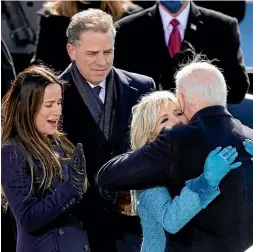  ?? AP ?? Hunter Biden and his sister Ashley support their father, President Joe Biden, and first lady Jill Biden at the president’s inaugurati­on. Right, for all its flaws, Hunter Biden’s memoir does reveal the utter joylessnes­s of addiction.