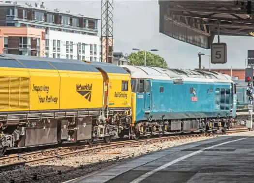  ?? GLEN BATTEN. ?? On July 7, preserved 50008 Thunderer stands at Bristol Temple Meads with an Okehampton-Chaddesden Sidings move, hauling a rail grinder following tests. Resignalli­ng at Bristol has been delayed as Network Rail moved its resources to ensure Crossrail was...