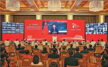  ?? YIN BOGU / XINHUA ?? President Xi Jinping addresses via video link on Wednesday the conference of the 70th anniversar­y of the China Council for the Promotion of Internatio­nal Trade and the Global Trade and Investment Promotion Summit.