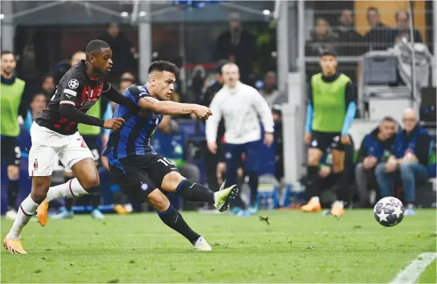  ?? Agence France-presse ?? ↑
Inter Milan’s Lautaro Martinez scores against AC Milan during their Champions League semi-final second leg match in Milan on Tuesday.