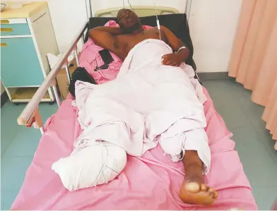  ?? STRINGER / REUTERS ?? Bakary Sanou, 36, who was injured during an attack on a road leading to the Boungou mine, operated by Canadian gold miner Semafo, lies in a hospital bed in Ouagadougo­u, Burkina Faso, on Friday.