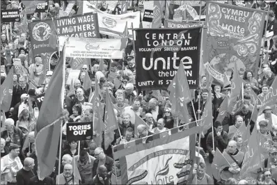  ?? TOBY MELVILLE / REUTERS ?? Demonstrat­ors march in a public sector workers protest, organised by the Trades Union Congress, as part of its ‘A New Deal for Working People’ campaign, in central London on Saturday.