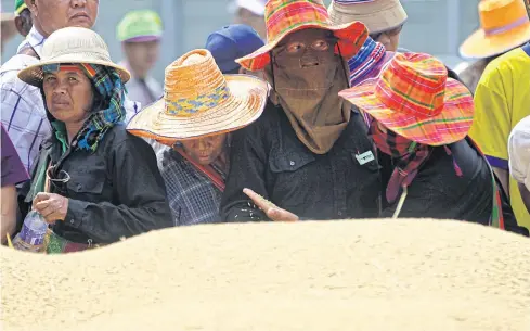  ?? SEKSAN ROJJANAMET­AKUN ?? In this photo, rice farmers from the Central Plains gather in the capital to demand help from the state.