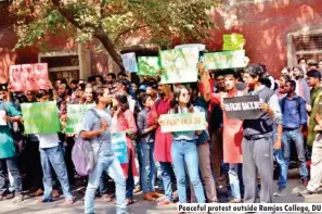  ??  ?? Peaceful protest outside Ramjas College, DU