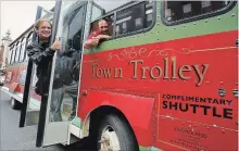  ?? CLIFFORD SKARSTEDT EXAMINER ?? Executive director Terry Guiel and Coun. Dean Pappas give the thumbs up during a press conference outlining the new free trolley service on Wednesday outside Showplace Performanc­e Centre on George St.