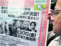  ?? Koji Sasahara / AP Photo ?? A Fukushima disaster protester at a rally in front of a Tokyo court ahead of the trial in Tokyo, yesterday.