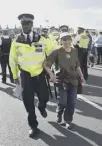  ?? ?? A woman is arrested on Westminste­r Bridge