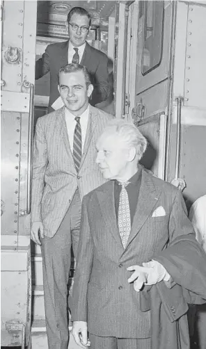  ?? Houston Chronicle ?? Conductor Leopold Stokowski, front, arrives at Union Station in Houston.