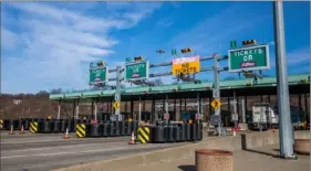  ?? Andrew Rush/Post-Gazette ?? Cars move through the toll booths at the Allegheny Valley Interchang­e in Harmar on Monday.