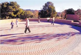  ?? COURTESY OF NEW MEXICO DEPARTMENT OF CULTURAL AFFAIRS ?? Visitors walk the labyrinth on Milner Plaza at the Museum of Indian Arts and Culture.