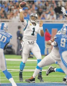  ?? | JOSE JUAREZ/ AP ?? Panthers quarterbac­k Cam Newton was 26- for- 33 for 355 yards Sunday against the Lions. He threw three TD passes.