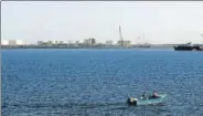  ?? REUTERS FILE ?? A speed boat passes by oil docks at the Chabahar port.