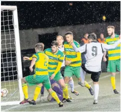  ?? Paul Watson ?? Widnes FC striker George Lomax nods home his team’s opening goal against Linnets.