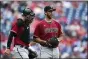  ?? DERIK HAMILTON — THE ASSOCIATED PRESS ?? Arizona Diamondbac­ks starting pitcher Madison Bumgarner, right, talks to catcher Carson Kelly on the mound during the first inning of a baseball game against the Philadelph­ia Phillies, Sunday, Aug. 29, 2021, in Philadelph­ia.