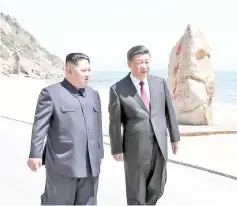  ??  ?? This photo released on May 8 by China’s Xinhua News Agency shows Kim Jong Un (left) meeting with Xi Jinping in Dalian. — AFP photo