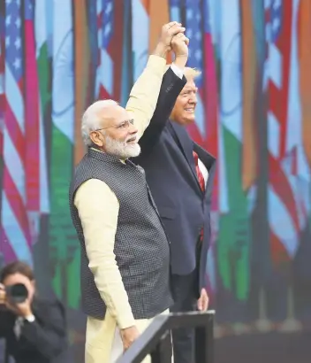  ?? Steve Gonzales / Staff photograph­er ?? Indian Prime Minister Narendra Modi and President Donald Trump attend the “Howdy, Modi!” event at Houston’s NRG Stadium. At the event, Trump touted India’s increasing trade with the U.S.