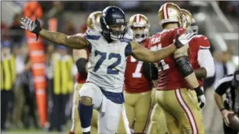 ?? BEN MARGOT — THE ASSOCIATED PRESS FILE ?? The Seattle Seahawks have reportedly traded defensive end Michael Bennett (72) to the Philadelph­ia Eagles in exchange for wide receiver Marcus Johnson and a fifth-round draft pick.