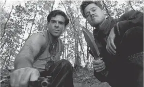  ??  ?? Eli Roth, left, and Brad Pitt are Nazi hunters with a dangerous mission in “Inglouriou­s Basterds.” FRANCOIS DUHAMEL/THE WEINSTEIN COMPANY