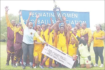  ?? ?? Young Buffaloes Ladies in a jovial mood after recieving their replica cheque and trophy.
