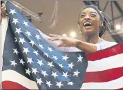  ?? VADIM GHIRDA — THE ASSOCIATED PRESS ?? Gymnast Simone Biles celebrates after taking the allaround world championsh­ip for the fourth time.