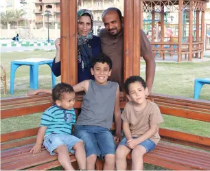  ??  ?? Hani Mahmoud Sultan and Suzan Salem with their three sons, Yusuf, Basil and Adam in the UAE.