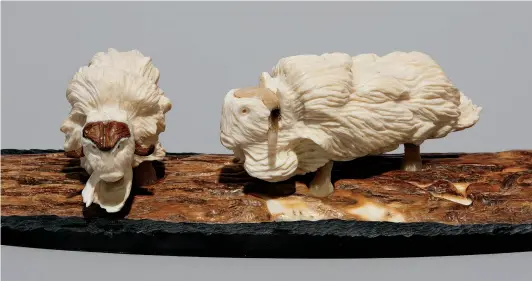  ?? COURTESY GALERIE ELCA LONDON ?? Damien Iquallaq(b. 1988 Uqsuqtuuq/ Iqaluktuut­tiaq)—Muskoxen20­18Mammoth ivory and muskox horn7 × 35.6 × 10.2 cm OPPOSITETr­aditional Inuit Tattoos 2016Stone and copper 61 × 35.6 × 22.9 cm COURTESY INUITSCULP­TURES.COM