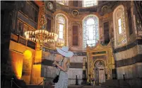  ?? EMRAH GUREL THE ASSOCIATED PRESS ?? A woman visits the Byzantine-era Hagia Sophia, an UNESCO World Heritage site.