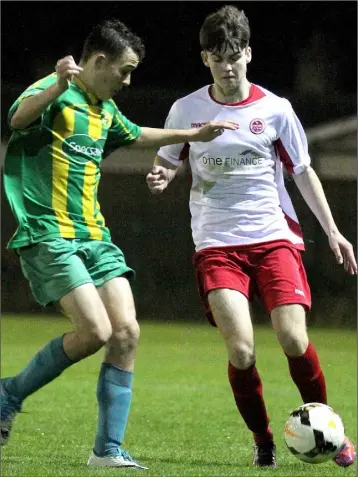  ??  ?? Aiden Curtin of Rock Celtic takes control under pressure from Dylan Shields.