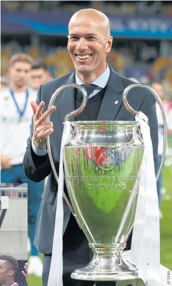  ??  ?? Real Madrid coach Zinedine Zidane celebrates with the Champions League trophy last month. RIGHT