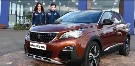  ??  ?? Kerry Footballer­s Aisling Desmond and Paul Murphy with the new Peugeot 3008 SUV at Reen’s Garage, Rathmore.