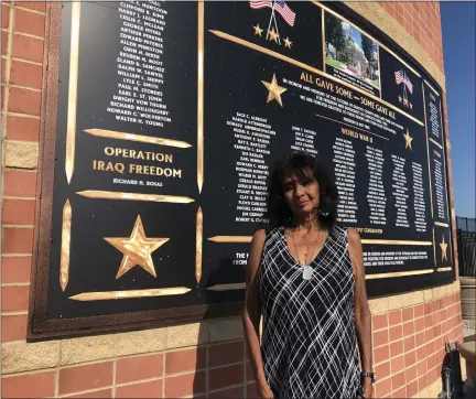  ?? JIM LAHDE — MORNING SUN ?? Apolonia Rosas stands in front of the Gratiot County Memorial plaque that honors every Gratiot County veteran and first responder that died in the line of duty dating back to 1900. Her son Richard H. Rosas died on Memorial Day in 2004in Operation Iraq Freedom.