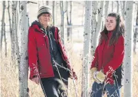  ?? DAVE CHIDLEY PHOTOS THE CANADIAN PRESS ?? Angie Birch, left, is a tour guide, and Alyx Harris is operations manager at the Yamnuska Wolfdog Sanctuary in Cochrane, Alta.