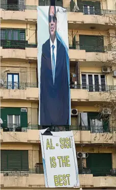  ?? — AP ?? Man of the hour: An election banner for Sissi hanging in Tahrir Square in Cairo.