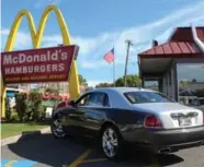  ??  ?? You probably shouldn’t, but we did anyway. We took a 2015 Rolls-Royce Ghost to Micky Dee’s.